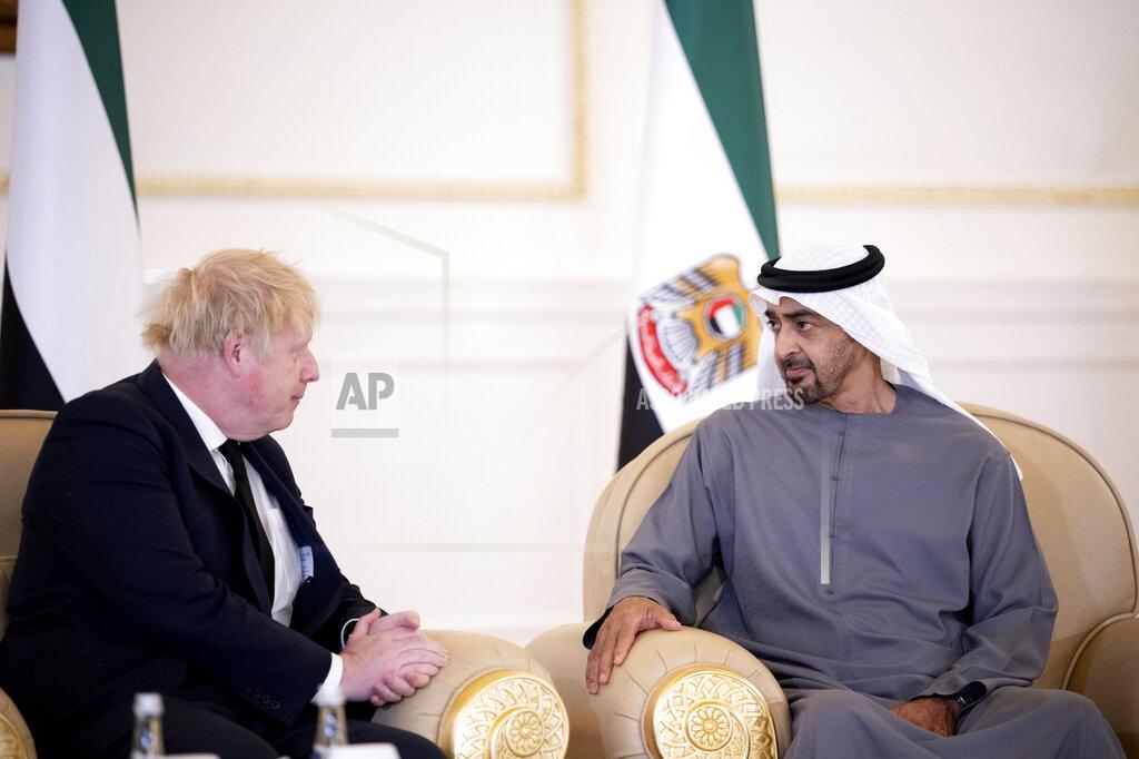 Abdulla Al Junaibi This photo made available by Ministry of Presidential Affairs shows, British Prime Minister Boris Johnson, left, offers his condolences to Sheikh Mohammed bin Zayed Al Nahyan, President of the UAE and Ruler of Abu Dhabi, on the passing of Sheikh Khalifa bin Zayed Al Nahyan, late President of the UAE, in Abu Dhabi, UAE, Sunday, May 15, 2022. (Abdulla Al Junaibi/Ministry of Presidential Affairs via AP)
