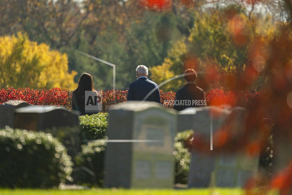 Carolyn Kaster President-elect Joe Biden, center, visits the cemetery where his son Beau, his wife Neilia, and daughter Naomi are buried at St. Joseph on the Brandywine Catholic Church, Sunday, Nov. 8, 2020, in Wilmington, Del. (AP Photo/Carolyn Kaster)