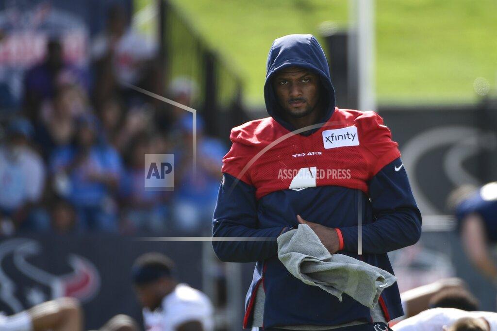 Justin Rex Texans quarterback Deshaun Watson (4) wipes his hands after stretching during NFL football practice Saturday, July 31, 2021, in Houston. (AP Photo/Justin Rex)