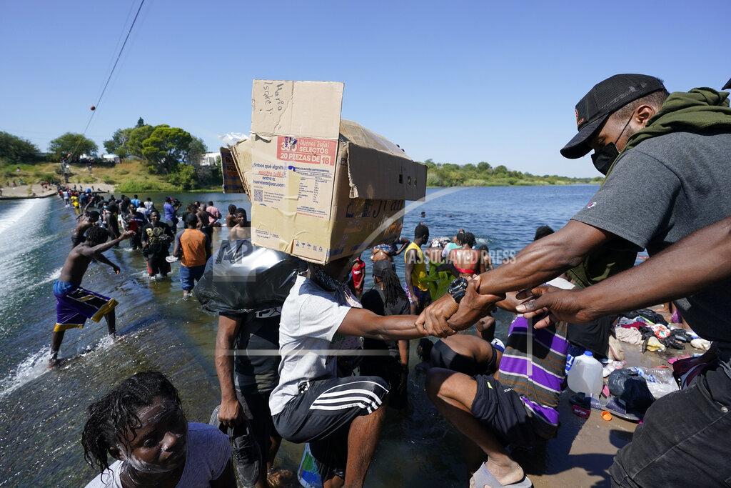 Eric Gay Haitian migrants use a dam to cross to and from the United States from Mexico, Friday, Sept. 17, 2021, in Del Rio, Texas. (AP Photo/Eric Gay)