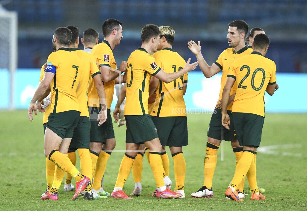 Jaber Abdulkhaleg Australia's Ajdin Hrustic, center, celebrates with his teammates after scoring his side's third goal during the World Cup 2022 Group B qualifying soccer match between Kuwait and Australia in Kuwait City, Kuwait, Thursday, June 3, 2021. (AP Photo/Jaber Abdulkhaleg)