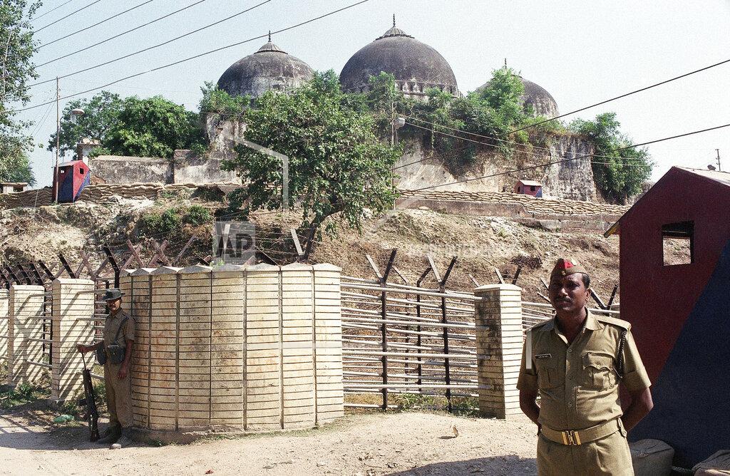 Barbara Walton FILE - In this Oct. 29, 1990, file photo, security officers guard the Babri Mosque in Ayodhya, closing off the disputed site claimed by Muslims and Hindus. India's Hindu nationalists have long claimed that thousands of medieval-era mosques are built on the sites of prominent temples that were demolished by Mughal rulers. One such campaign to reclaim these mosques culminated in 1992 with the destruction of the 16th century Babri mosque in the northern town of Ayodhya by Hindu mobs. (AP Photo/Barbara Walton, File)
