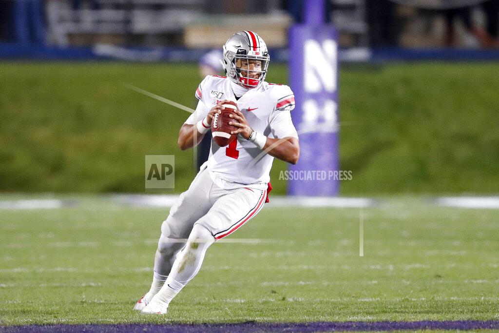 Charles Rex Arbogast Ohio State quarterback Justin Fields drops back to pass during the first half of an NCAA college football game against Northwestern, Friday, Oct. 18, 2019, in Evanston, Ill. (AP Photo/Charles Rex Arbogast)