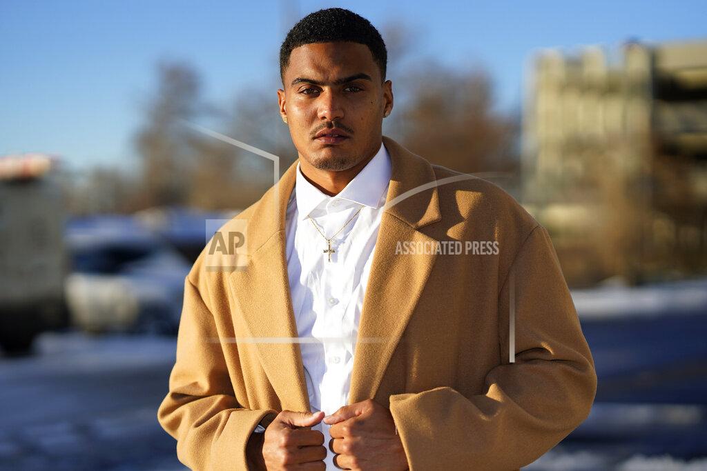 David Zalubowski Donte Westmoreland poses for a photo outside a hotel Tuesday, Dec. 15, 2020, in southeast Denver. Westmoreland was recently released from Lansing Correctional Facility in Kansas, where he caught the virus while serving time on a marijuana charge. Some 5,000 prisoners have become infected in Kansas prisons, the second-highest COVID-19 rate in the country, second only to South Dakota. (AP Photo/David Zalubowski)