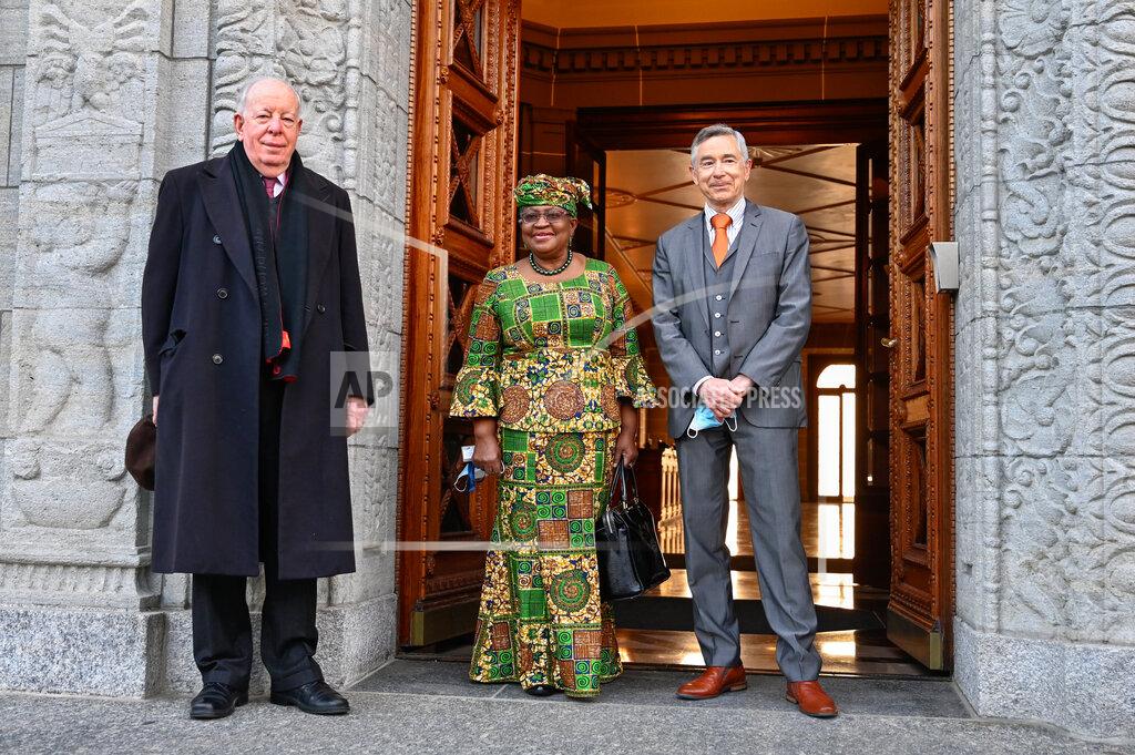 Fabrice Coffrini New Director-General of the World Trade Organisation Ngozi Okonjo-Iweala, center, poses between WTO Deputy Directors-General Alan Wolff, left, and Karl Brauner upon her arrival at the WTO headquarters to takes office in Geneva, Switzerland, Monday, March 1, 2021. Nigeria's Ngozi Okonjo-Iweala takes the reins of the WTO amid hope she will infuse the beleaguered body with fresh momentum to address towering challenges and a pandemic-fuelled global economic crisis. (Fabrice Coffrini/Pool/Keystone via AP)