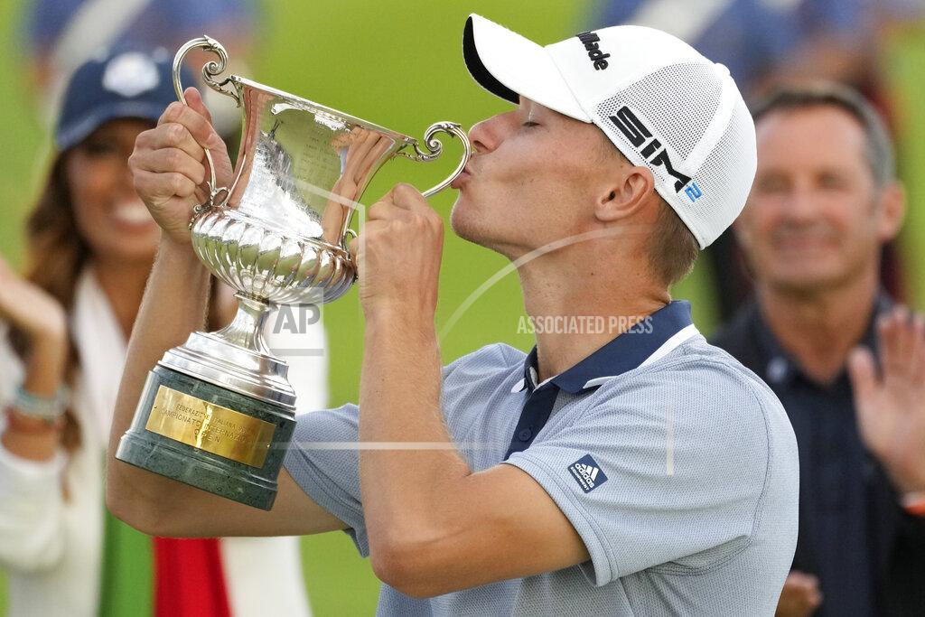 Andrew Medichini Nicolai Hojgaard of Denmark kisses the trophy of the Italian Open golf tournament he just won, in Guidonia, in the outskirts of Rome, Sunday, Sept. 5, 2021. The Italian Open took place on the redesigned Marco Simone course just outside Rome that will host the 2023 Ryder Cup.(AP Photo/Andrew Medichini)