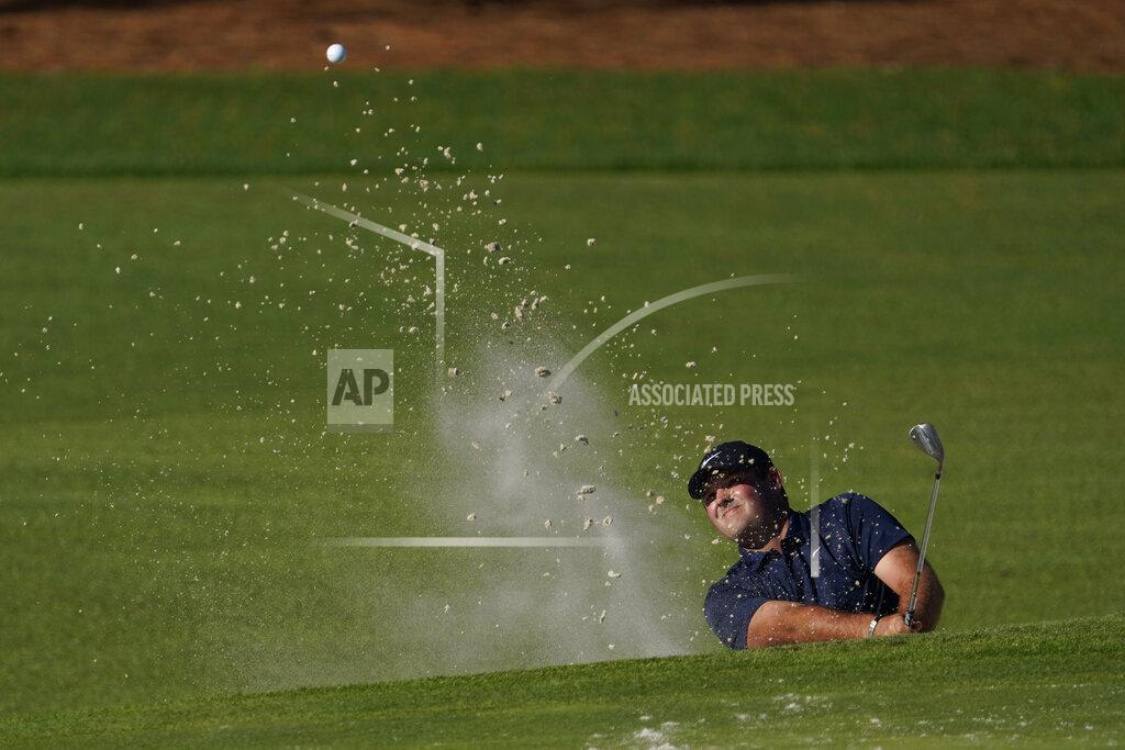 David J. Phillip Patrick Reed hits out of a bunker on the second hole during the second round of the Masters golf tournament Friday, Nov. 13, 2020, in Augusta, Ga. (AP Photo/David J. Phillip)