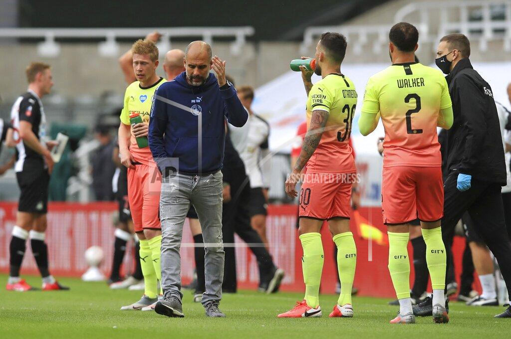 Owen Humphreys Manchester City's head coach Pep Guardiola reacts during a drinks break during the FA Cup sixth round soccer match between Newcastle United and Manchester City at St. James' Park in Newcastle, England, Sunday, June 28, 2020. (Owen Humphreys/Pool via AP)