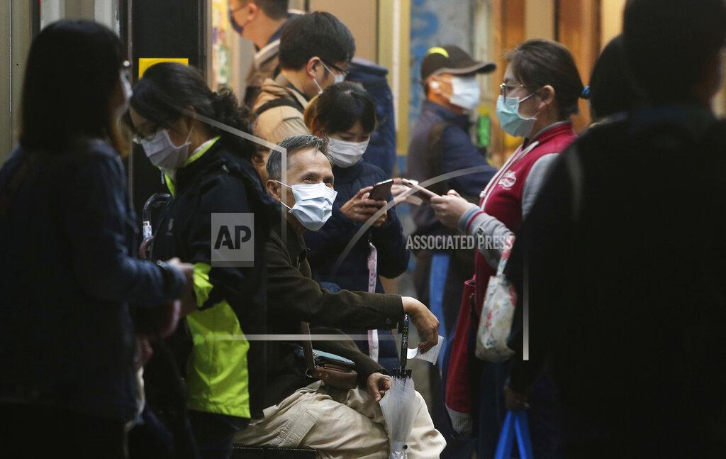Chiang Ying-Ying People wear face masks to help curb the spread of the coronavirus in a public area of Taipei, Taiwan, Monday, Nov. 30, 2020. (AP Photo/Chiang Ying-ying)