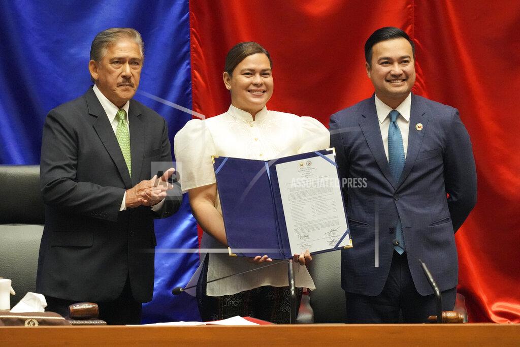 Aaron Favila Vice-president-elect Sara Duterte, center, poses with Senate President Vicente Sotto III, left, and House Speaker Lord Allan Velasco during her proclamation at the House of Representatives, Quezon City, Philippines on Wednesday, May 25, 2022. Sara is the daughter of outgoing president Rodrigo Duterte. (AP Photo/Aaron Favila)