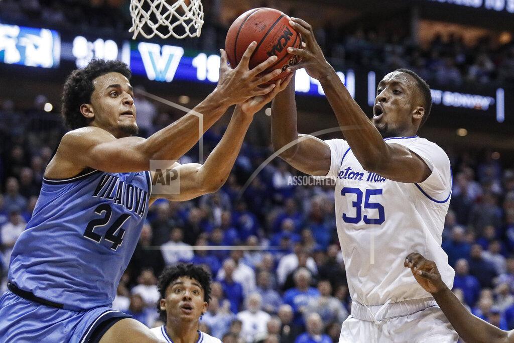 John Minchillo Villanova's Jeremiah Robinson-Earl (24) and Seton Hall's Romaro Gill (35) battle for a rebound during the first half of an NCAA college basketball game, Wednesday, March 4, 2020, in Newark, N.J. (AP Photo/John Minchillo)