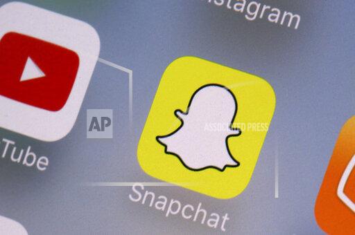 FILE- This Aug. 9, 2017, file photo shows the Youtube, left, and Snapchat apps on a mobile device in New York. The leaders of a Senate panel have called executives from YouTube, TikTok and Snapchat to face questions on what the companies are doing to ensure young users’ safety. The hearing Tuesday, Oct. 26, 2021, comes as the panel bears down on hugely popular social media platforms and their impact on children. (AP Photo/Richard Drew, File)
