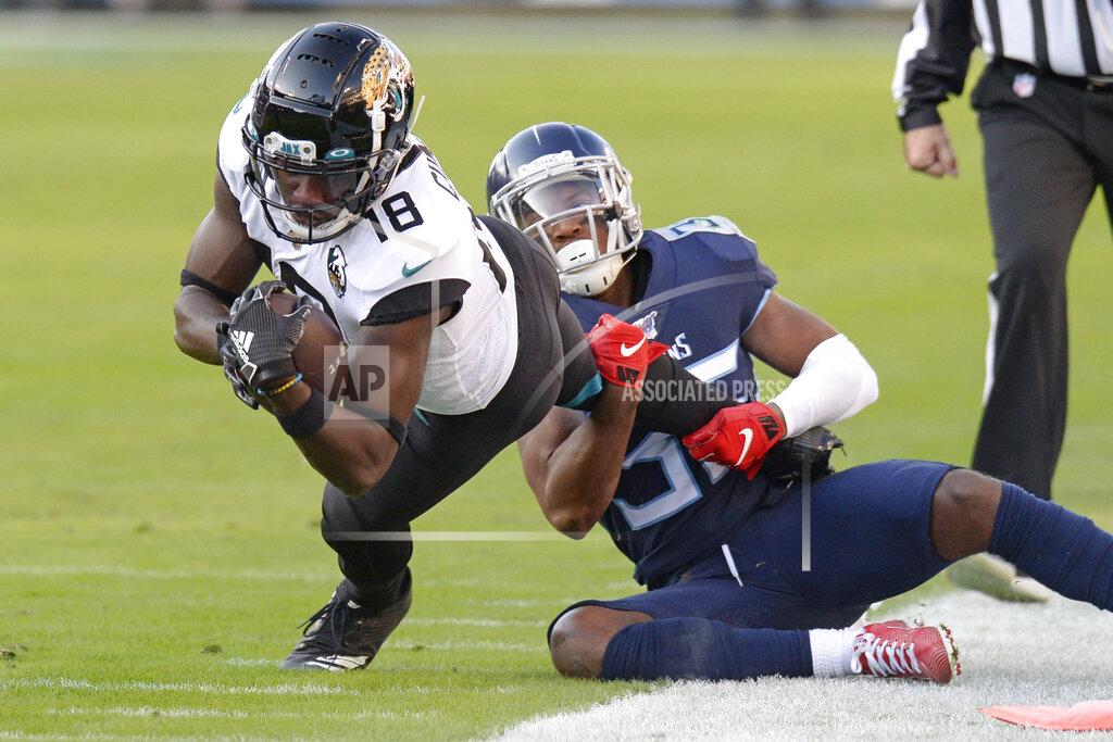 Mark Zaleski Jacksonville Jaguars wide receiver Chris Conley (18) is brought down by Tennessee Titans cornerback LeShaun Sims (36) in the first half of an NFL football game Sunday, Nov. 24, 2019, in Nashville, Tenn. (AP Photo/Mark Zaleski)