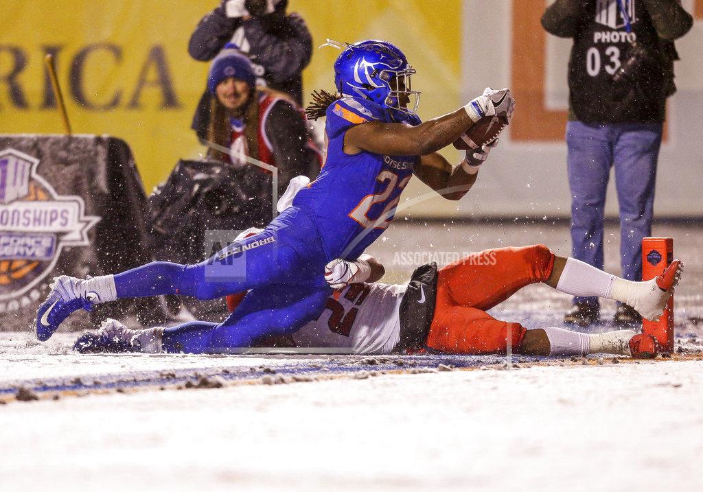 Steve Conner Boise State running back Alexander Mattison (22) dives for the end zone on a touchdown run, over Fresno State's Juju Hughes in the second half of an NCAA college football game for the Mountain West championship, Saturday, Dec. 1, 2018, in Boise, Idaho. Fresno State won 19-16. (AP Photo/Steve Conner)