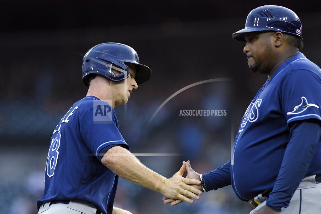 Jose Juarez Tampa Bay Rays' Joey Wendle, left, is congratulated by third base coach Rodney Linares after hitting a home run off Detroit Tigers pitcher Bryan Garcia during the fourth inning of a baseball game Saturday, Sept. 11, 2021, in Detroit. (AP Photo/Jose Juarez)
