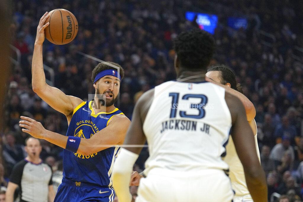 Tony Avelar Golden State Warriors guard Klay Thompson (11) looks to pass the ball in front of Memphis Grizzlies forward Jaren Jackson Jr. (13) during the first half of Game 6 of an NBA basketball Western Conference playoff semifinal in San Francisco, Friday, May 13, 2022. (AP Photo/Tony Avelar)