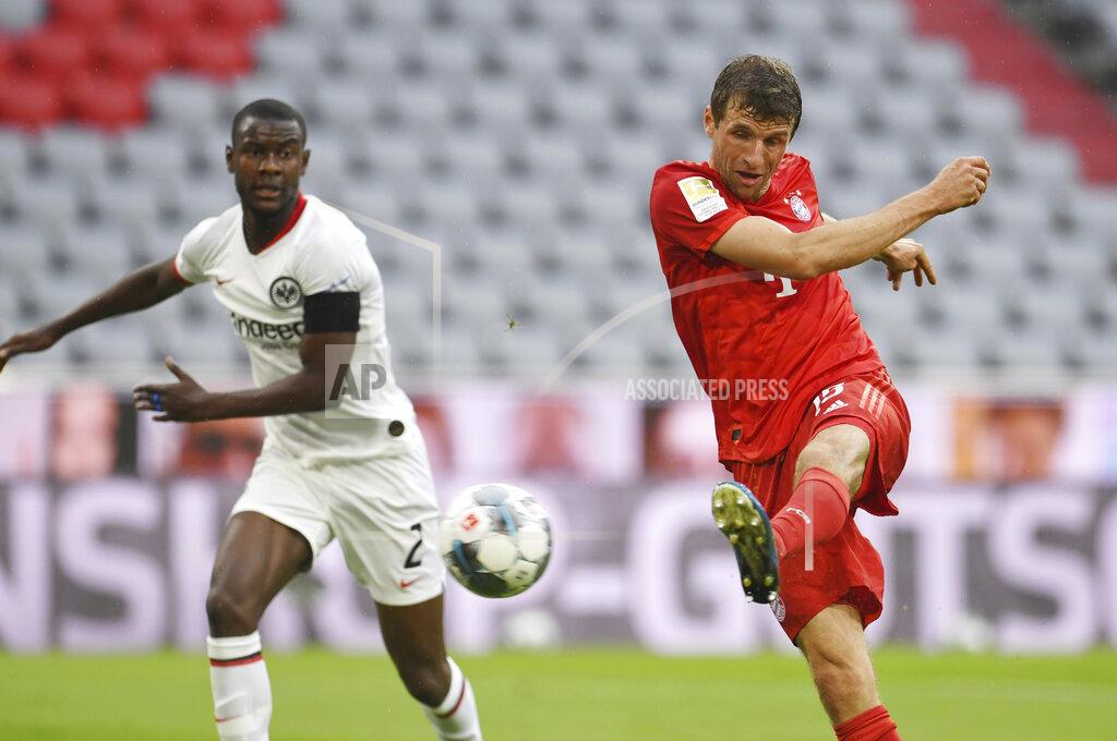 Andreas Gebert Bayern Munich's Thomas Muller scores his side's second goal during the German Bundesliga soccer match between Bayern Munich and Eintracht Frankfurt in Munich, Germany, Saturday, May 23, 2020. (Andreas Gebert/pool via AP)