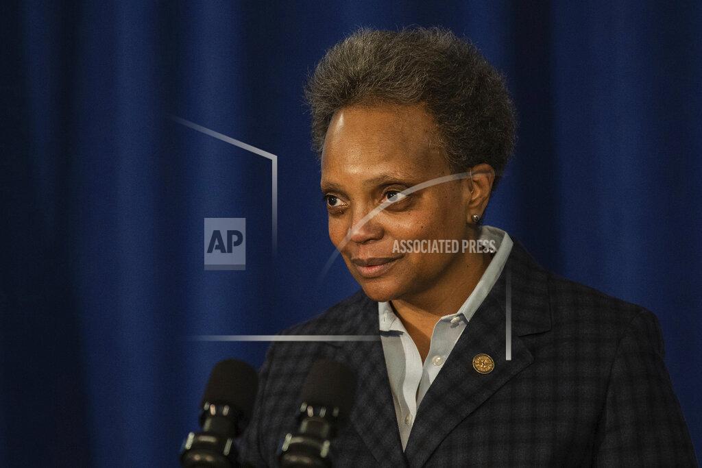 Pat Nabong Chicago Mayor Lori Lightfoot clears her throat during a press conference where she demanded the Chicago Teachers Union to reach a deal with Chicago Public Schools on a reopening plan at City Hall, Thursday, Feb. 4, 2021. (Pat Nabong/Chicago Sun-Times via AP)