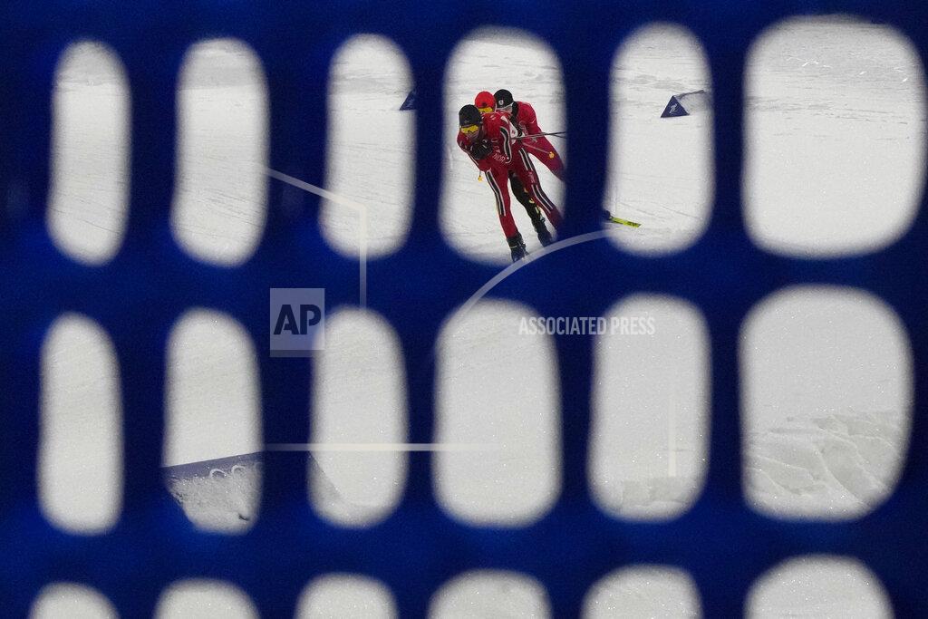 Aaron Favila Norway's Espen Bjoernstad leads a group during the cross-country skiing competition of the team Gundersen large hill/4x5km at the 2022 Winter Olympics, Thursday, Feb. 17, 2022, in Zhangjiakou, China. (AP Photo/Aaron Favila)