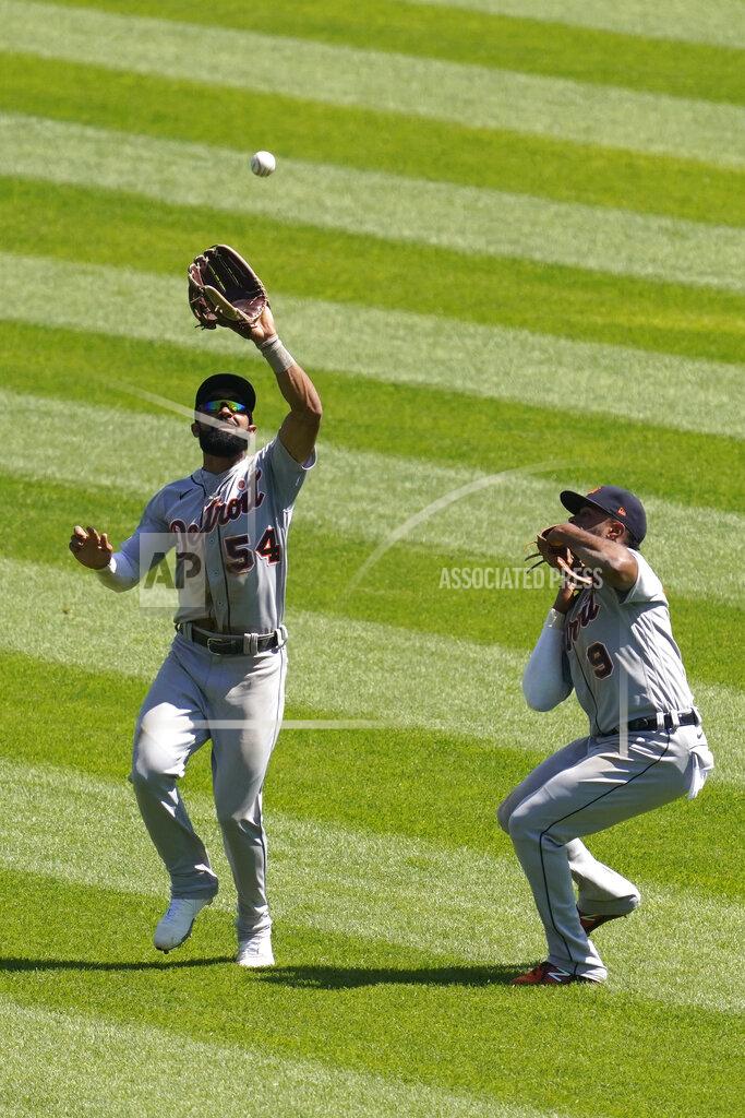 Nam Y. Huh Detroit Tigers center fielder Derek Hill, left, catches a fly ball hit by Chicago White Sox's Jose Abreu as Detroit Tigers shortstop Willi Castro, right, watches during the fifth inning of a baseball game in Chicago, Saturday, June 5, 2021. (AP Photo/Nam Y. Huh)