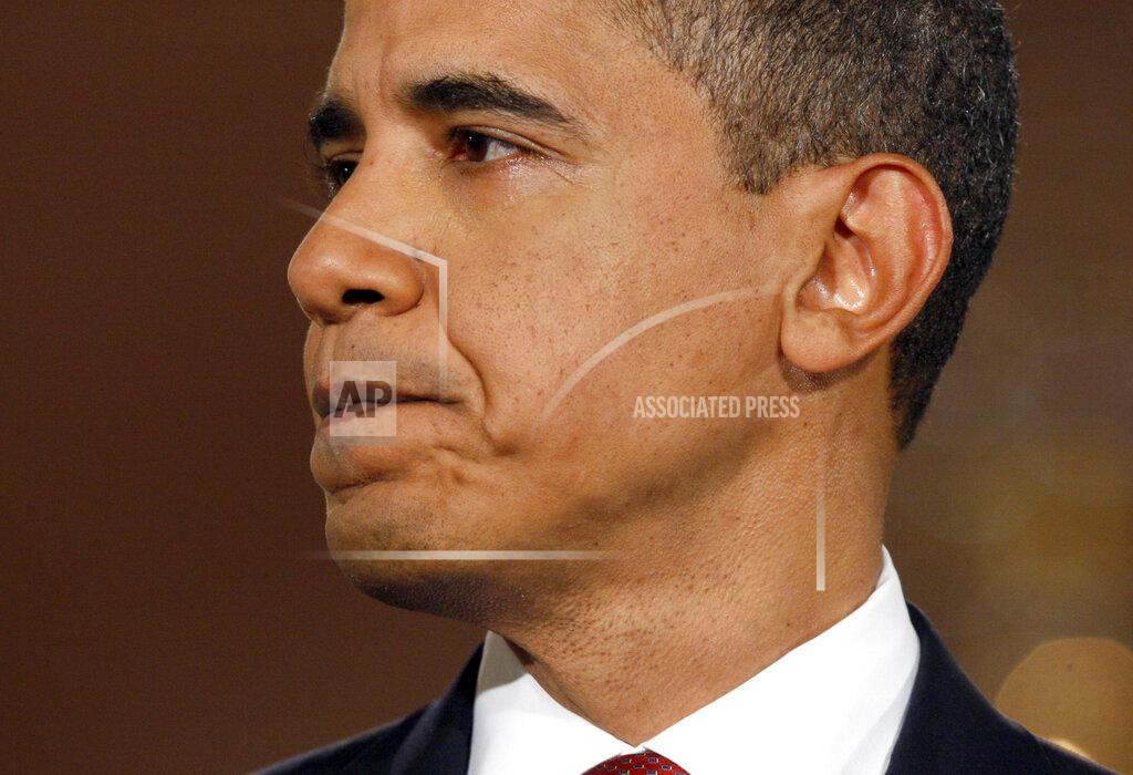 Charles Dharapak FILE - In this Feb. 9, 2009, file photo President Barack Obama listens to a question during his first prime time televised news conference in the East Room of the White House in Washington. (AP Photo/Charles Dharapak, File)
