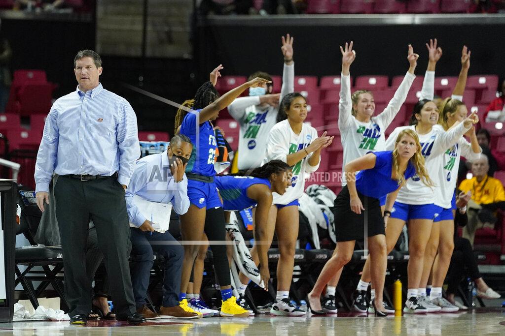 Julio Cortez Florida Gulf Coast head coach Karl Smesko, left, looks on as his bench reacts to a three point shot by guard Kendall Spray during the first half of a college basketball game against Maryland in the second round of the NCAA tournament, Sunday, March 20, 2022, in College Park, Md. (AP Photo/Julio Cortez)