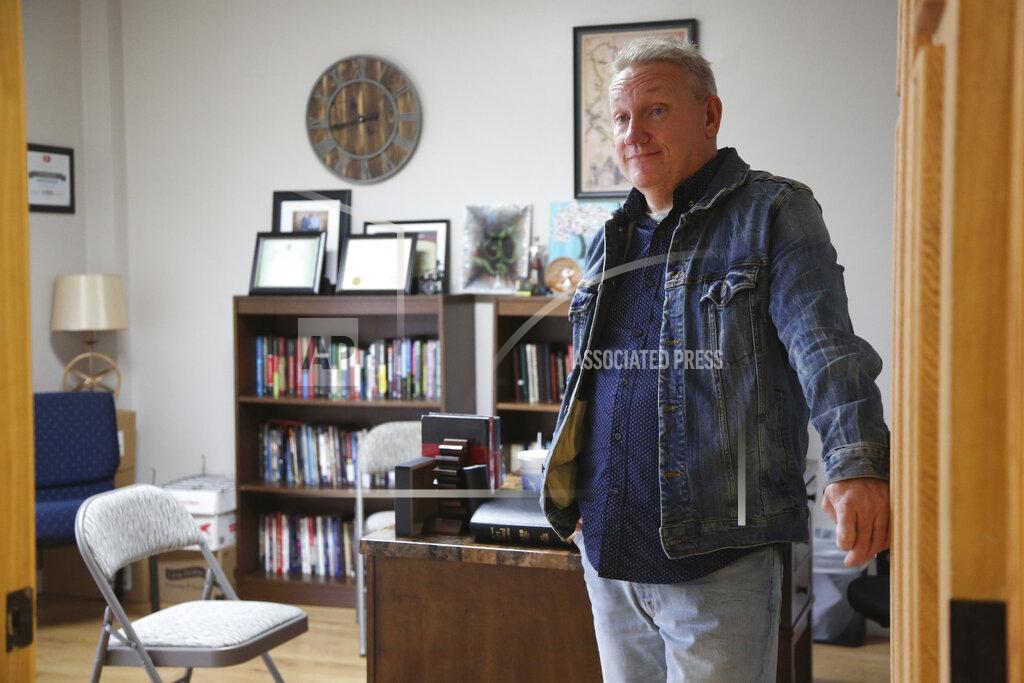 Doyle Bradford, pastor of Father's House International Church in Bluefield, W.Va, stands in the doorway of his office on Monday, Jan. 25, 2021. Bradford stirred some controversy among religious leaders in his community for attending the "Save America" rally in Washington on Jan. 6 and for some of his social media posts on politics. (AP Photo/Jessie Wardarski)