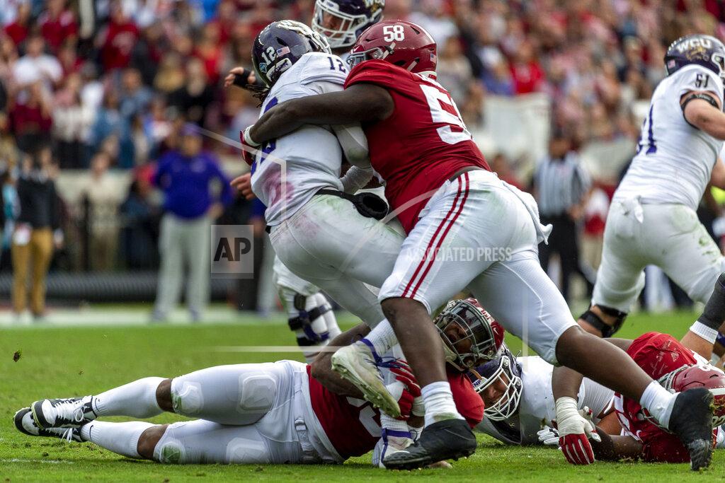 FILE - Alabama defensive lineman Christian Barmore (58) sacks Western Carolina quarterback Tyrie Adams (12) during the first half of an NCAA college football game in Tuscaloosa, Ala., in this Saturday, Nov. 23, 2019, file photo. Barmore is rated as the draft's best tackle among a weak group and could be gone unless the Browns move to get him. (AP Photo/Vasha Hunt, File)
