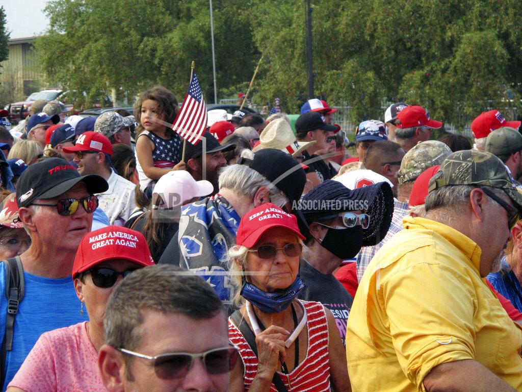 Scott Sonner People line up outside the gates three hours before President Donald Trump is scheduled to speak Saturday night at a campaign rally at Minden-Tahoe Airport under smoky skies from California wildfires along the Sierra Nevada's eastern front in Minden, Nev., Saturday, Sept. 12, 2020 (AP Photo/Scott Sonner)