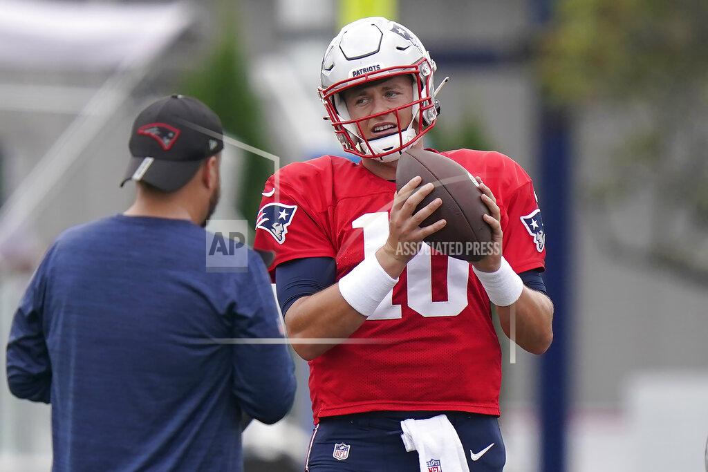 New England Patriots quarterback Mac Jones (10) warms up during NFL football practice, Wednesday, Sept. 15, 2021, in Foxborough, Mass. (AP Photo/Steven Senne)