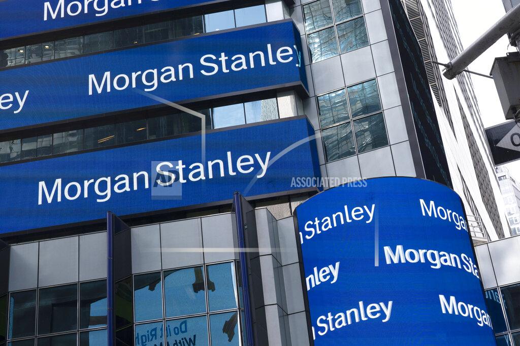 Mark Lennihan FILE - In this Thursday, March 4, 2021, file photo, electronic signage is shown at Morgan Stanley headquarters, in New York. Wall Street’s big investment banks are sending a message to their employees this summer: Get back into the office, and bring your vaccination card. Morgan Stanley said this week that all employees will be required to attest to their vaccination status. (AP Photo/Mark Lennihan, File)