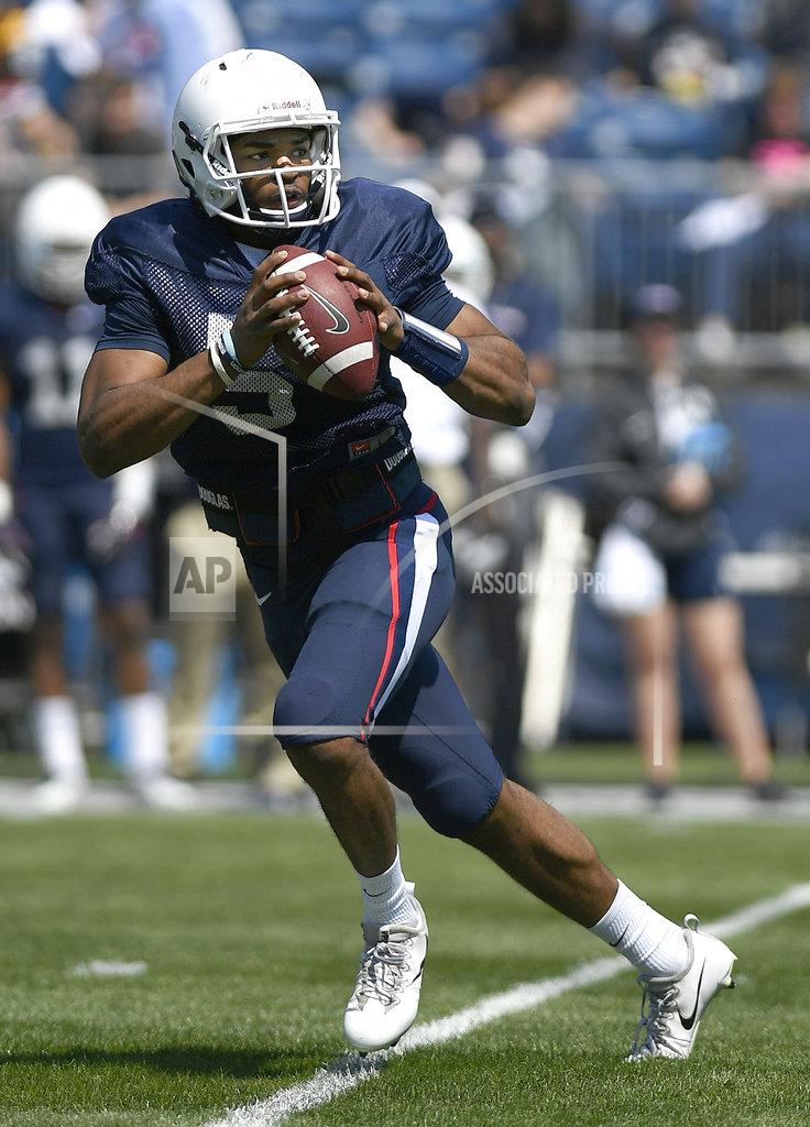 Jessica Hill FILE - In this April 14, 2018, file photo, quarterback David Pindell looks to pass during Connecticut's annual spring NCAA college football game in East Hartford, Conn. UConn will host Central Florida to open the regular season on Thursday night, Aug. 30. (AP Photo/Jessica Hill, File)