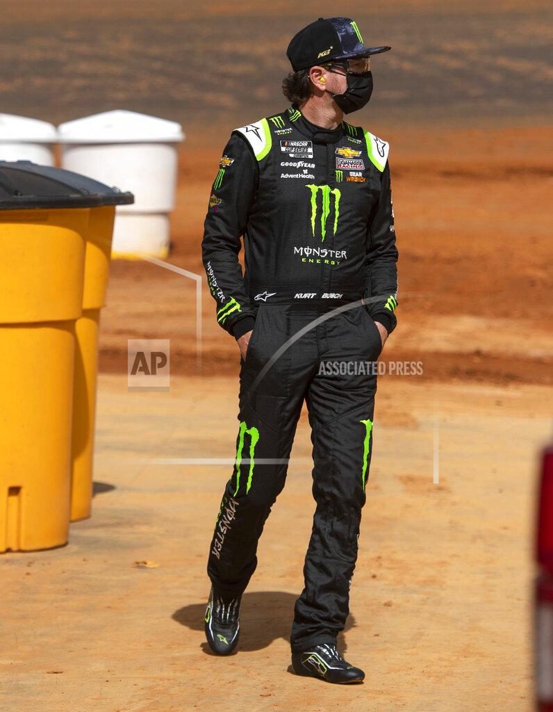 David Crigger Kurt Busch watches from pit road as drivers finish their practice for the NASCAR Trucks Series, Friday, March 26, 2021, at Bristol Motor Speedway in Bristol, Tenn. (David Crigger/Bristol Herald Courier via AP)