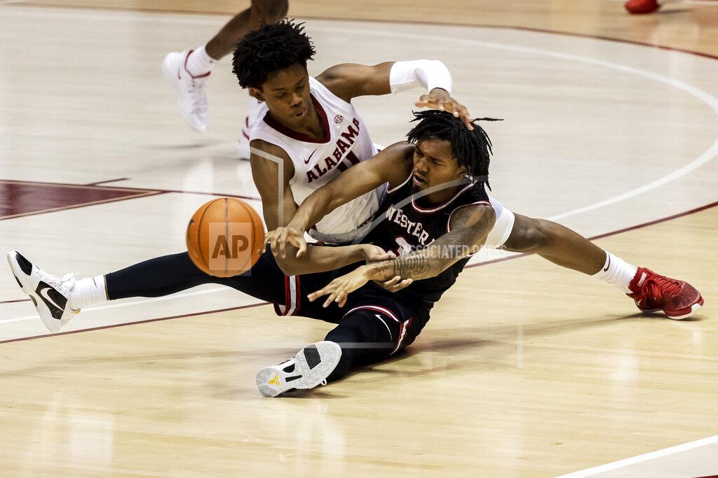 Vasha Hunt Alabama guard Joshua Primo (11) and Western Kentucky guard Jordan Rawls (3) battle for a loose ball during the second half of an NCAA college basketball game, Saturday, Dec. 19, 2020, in Tuscaloosa, Ala. (AP Photo/Vasha Hunt)