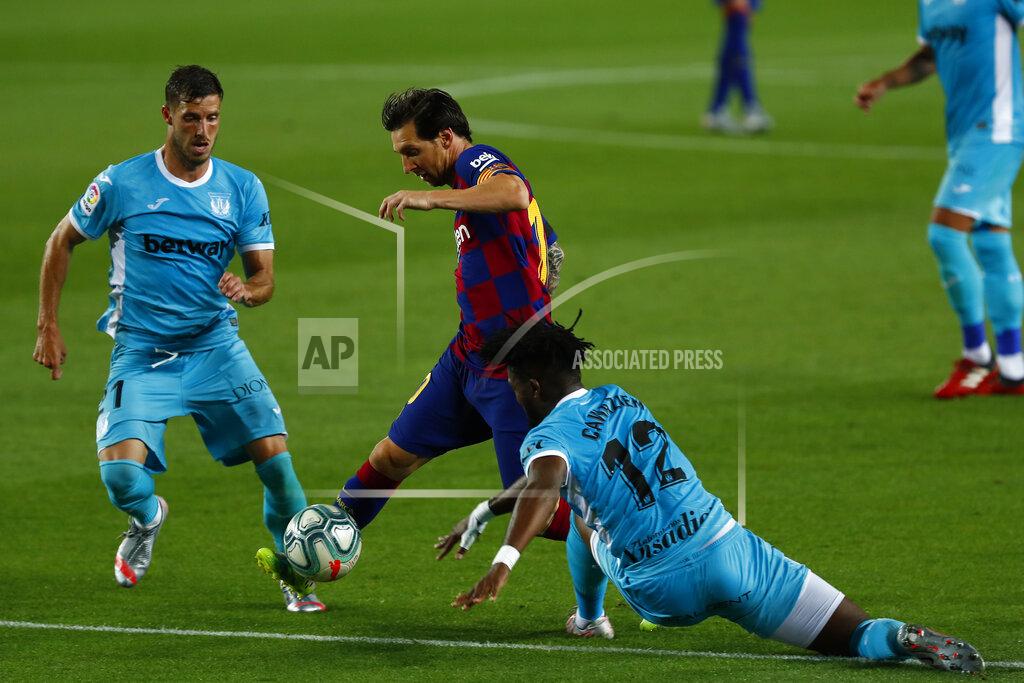 Joan Monfort Barcelona's Lionel Messi, center, vies for the ball with Leagnes' Chidozie Awaziem, right, and Leganes' Ruben Perez during the Spanish La Liga soccer match between FC Barcelona and Leganes at the Camp Nou stadium in Barcelona, Spain, Tuesday, June 16, 2020. (AP Photo/Joan Montfort)