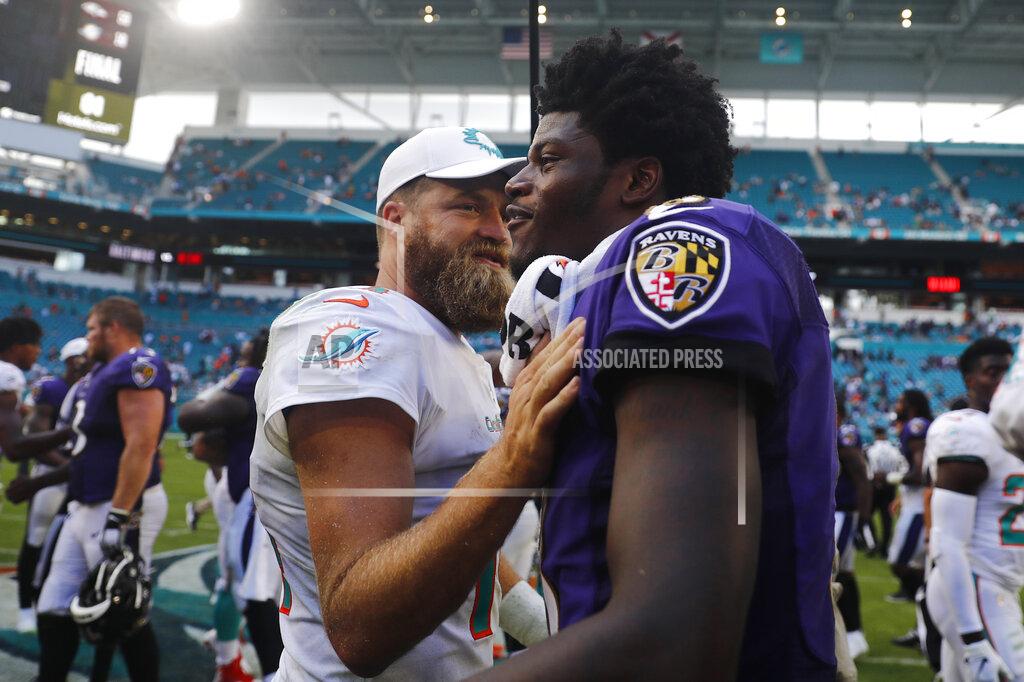 Brynn Anderson Miami Dolphins quarterback Ryan Fitzpatrick (14) congratulates Baltimore Ravens quarterback Lamar Jackson (8), at the end of an NFL football game, Sunday, Sept. 8, 2019, in Miami Gardens, Fla. The Ravens defeated the Dolphins 59-10. (AP Photo/Brynn Anderson)