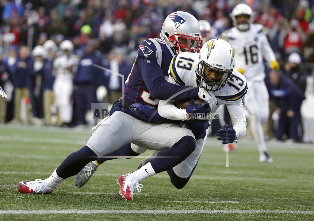 Elise Amendola Los Angeles Chargers wide receiver Keenan Allen (13) drags New England Patriots defensive back Jason McCourty across the goal line for a touchdown during the second half of an NFL divisional playoff football game, Sunday, Jan. 13, 2019, in Foxborough, Mass. (AP Photo/Elise Amendola)
