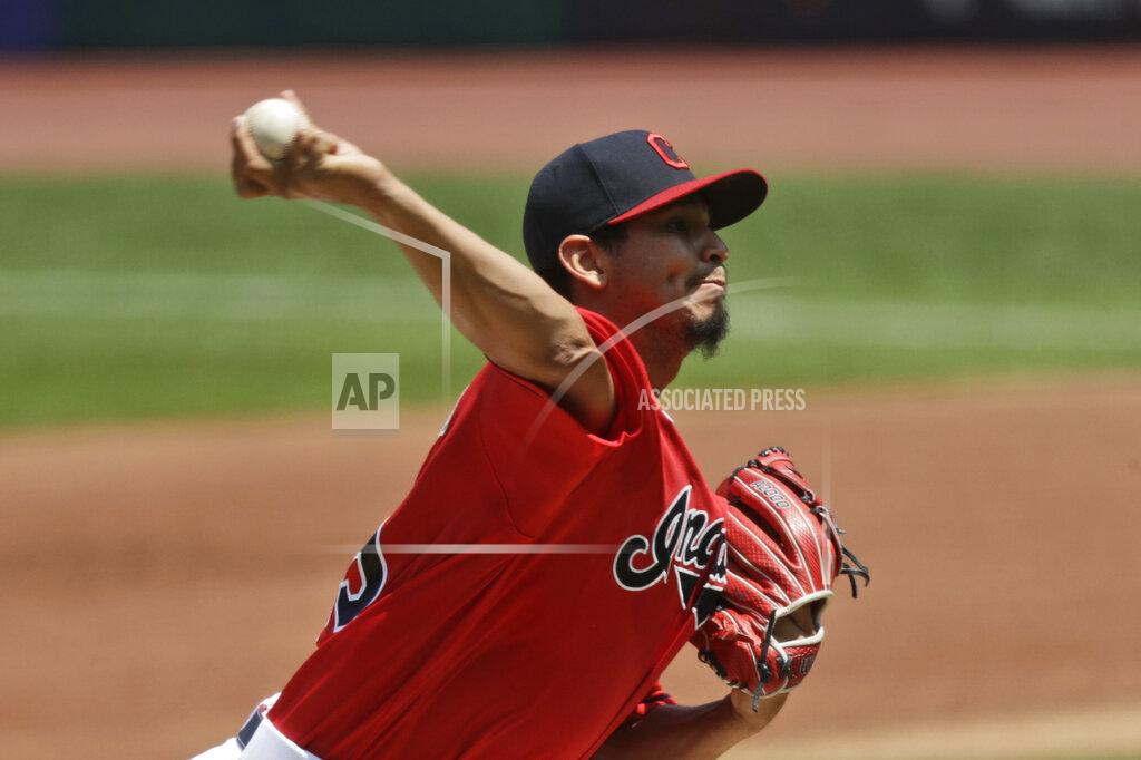 Tony Dejak Cleveland Indians starting pitcher Carlos Carrasco delivers in the first inning in a baseball game against the Kansas City Royals, Sunday, July 26, 2020, in Cleveland. (AP Photo/Tony Dejak)