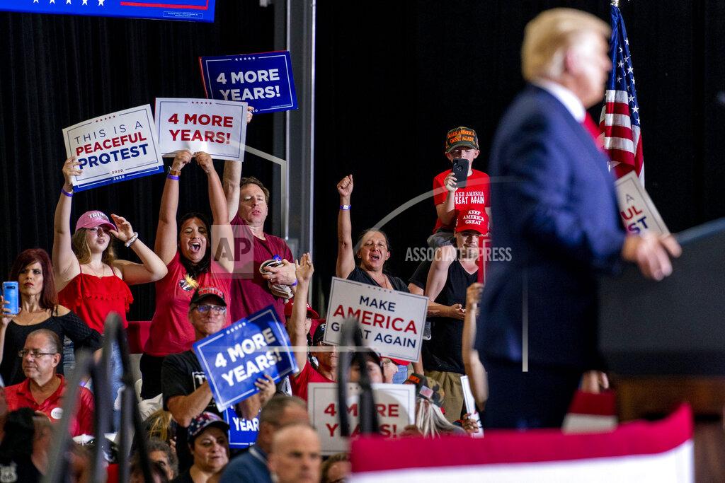 Andrew Harnik Supporters cheer as President Donald Trump speaks at a rally at Xtreme Manufacturing, Sunday, Sept. 13, 2020, in Henderson, Nev. (AP Photo/Andrew Harnik)