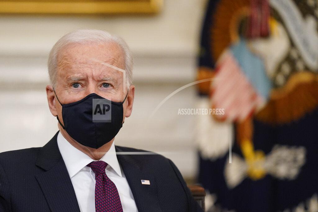 Patrick Semansky President Joe Biden participates in a roundtable discussion on a coronavirus relief package in the State Dining Room of the White House in Washington, Friday, March 5, 2021. (AP Photo/Patrick Semansky)