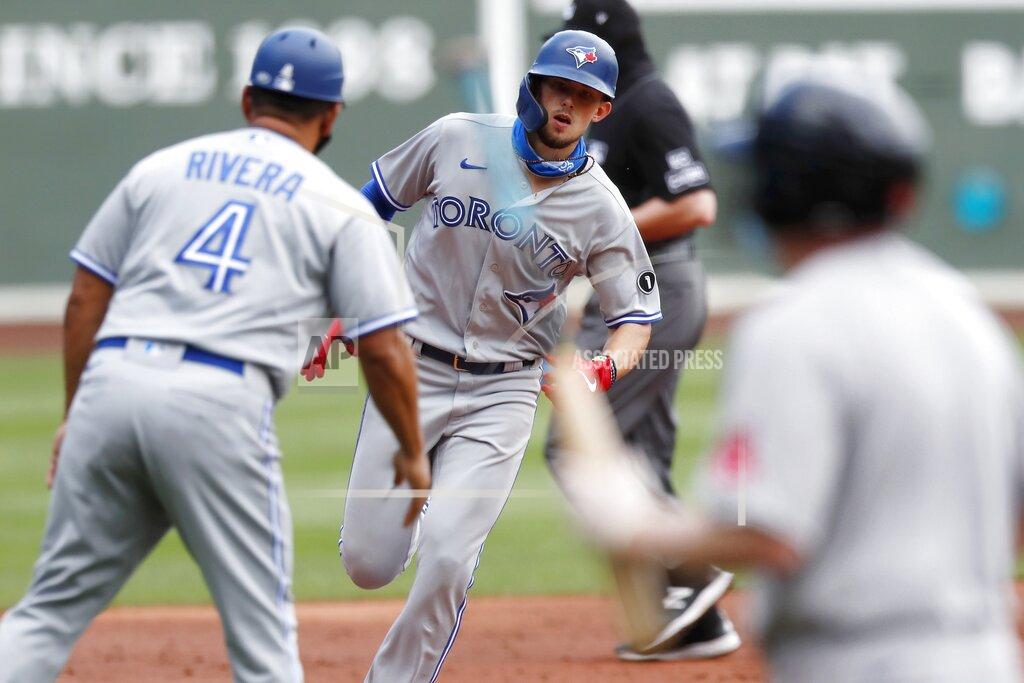 Michael Dwyer Toronto Blue Jays' Cavan Biggio, center, rounds third base on his solo home run during the third inning of a baseball game against the Boston Red Sox, Sunday, Aug. 9, 2020, in Boston. (AP Photo/Michael Dwyer)