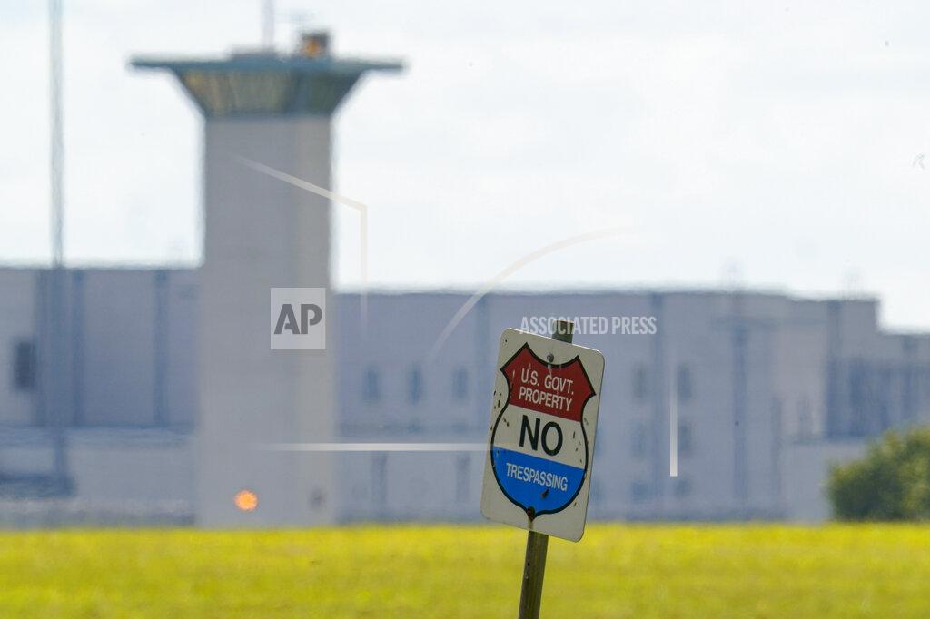 FILE - In this Aug. 26, 2020, file photo, the federal prison complex in Terre Haute, Ind. All federal prisons in the United States have been placed on lockdown, with officials aiming to quell any potential violence that could arise behind bars as law enforcement prepares for potentially violent protests across the country in the run-up to President-elect Joe Biden's inauguration on Wednesday. (AP Photo/Michael Conroy, File)
