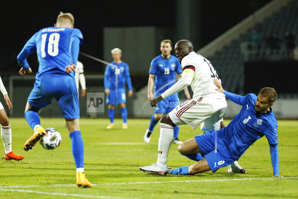 Brynjar Gunnarsson Iceland's Holmar Eyjolfsson, right, and Belgium's Romelu Lukaku, centre, battle for the ball during the UEFA Nations League soccer match between Iceland and Belgium at the Laugardalsvollur stadium in Reykjavik, Iceland, Wednesday, Oct. 14, 2020. (AP Photo/Brynjar Gunnarsson)