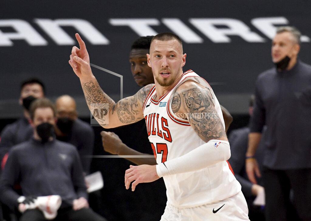 Jason Behnken Chicago Bulls center Daniel Theis celebrates a dunk against the Toronto Raptors during the second half of an NBA basketball game Thursday, April 8, 2021, in Tampa, Fla. (AP Photo/Jason Behnken)