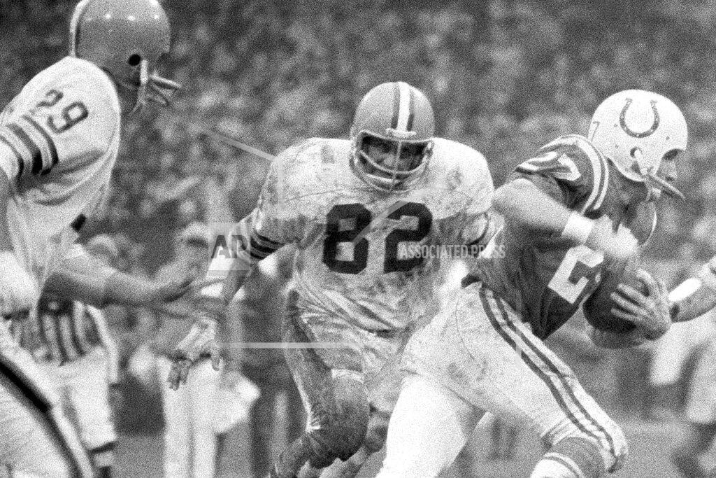 Anonymous FILE - In this Dec. 26, 1971, file photo, Cleveland Browns linebacker Jim Houston (82) chases after Baltimore Colts wide receiver Ray Perkins during a football game in Cleveland. Houston's widow would keep notes on her husband's deteriorating condition in a three-ring binder so she would be prepared for the day when he needed full-time care. (AP Photo/FIle)