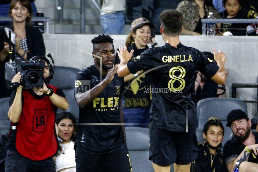 Ringo H.W. Chiu Los Angeles FC midfielder Jose Cifuentes, left, celebrates his goal with Francisco Ginella (8) during the second half of the team's MLS soccer match against the Vancouver Whitecaps in Los Angeles, Saturday, July 24, 2021. The game ended in a 2-2 draw. (AP Photo/Ringo H.W. Chiu)