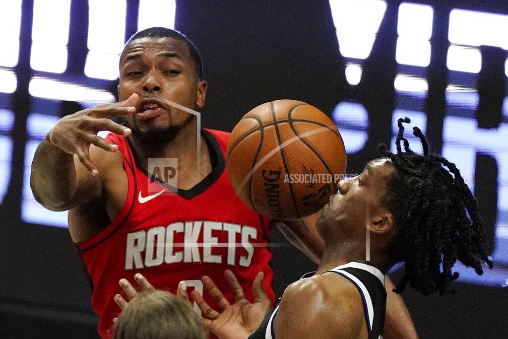 Mark J. Terrill Los Angeles Clippers guard Terance Mann, right, loses control of the ball while under pressure from Houston Rockets forward Sterling Brown during the second half of an NBA basketball game Friday, April 9, 2021, in Los Angeles. The Clippers won 126-109. (AP Photo/Mark J. Terrill)
