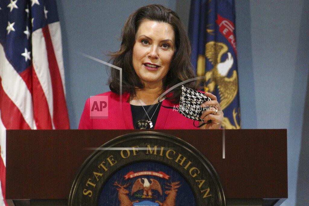 Uncredited FILE - In this Thursday, May 21, 2020 file photo provided by the Michigan Office of the Governor, Michigan Gov. Gretchen Whitmer speeks during a news conference in Lansing, Mich. Gov. Whitmer on Friday, May 22, 2020, extended Michigan's stay-at-home order just over two additional weeks, through June 12, also keeping closed theaters, gyms and other places of public accommodation at least until that time.
She also extended her emergency declaration through June 19. (Michigan Office of the Governor via AP, Pool) File