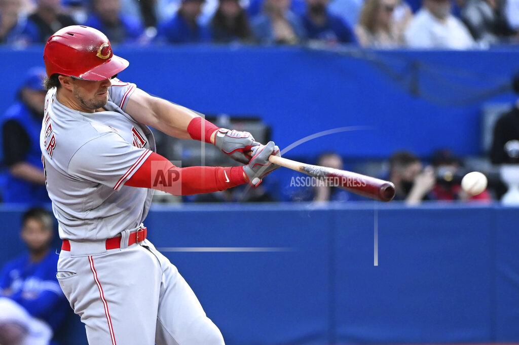 Jon Blacker Cincinnati Reds' Kyle Farmer hits a double against the Toronto Blue Jays during the second inning of a baseball game Friday, May 20, 2022, in Toronto. (Jon Blacker/The Canadian Press via AP)