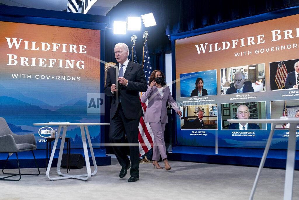 Andrew Harnik President Joe Biden and Vice President Kamala Harris arrive for a meeting with governors to discuss ongoing efforts to strengthen wildfire prevention, preparedness and response efforts, and hear firsthand about the ongoing impacts of the 2021 wildfire season in the South Court Auditorium in the Eisenhower Executive Office Building on the White House Campus in Washington, Friday, July 30, 2021. (AP Photo/Andrew Harnik)